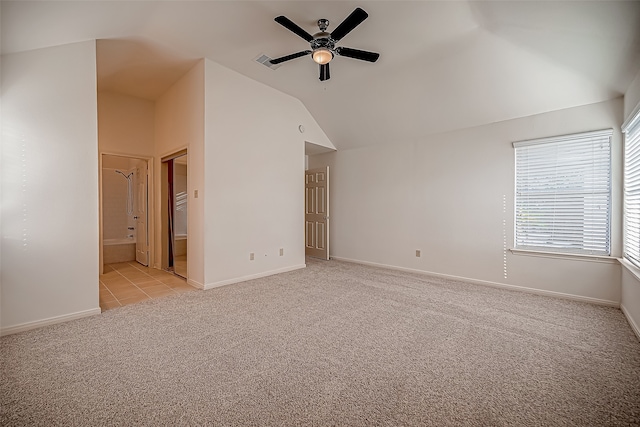 interior space with ceiling fan and vaulted ceiling