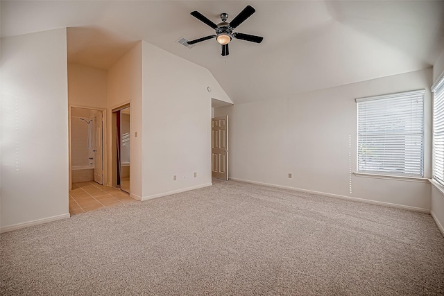 2810 Pineleaf Dr, Sugar Land, TX 77479 - unfurnished bedroom with light colored carpet, vaulted ceiling, baseboards, and ensuite bath