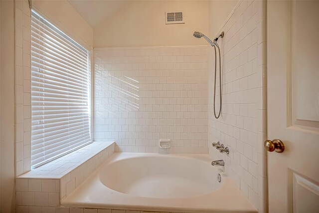 2810 Pineleaf Dr, Sugar Land, TX 77479 - bathroom featuring lofted ceiling and shower / tub combination