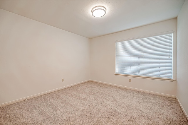 2810 Pineleaf Dr, Sugar Land, TX 77479 - spare room with carpet and baseboards