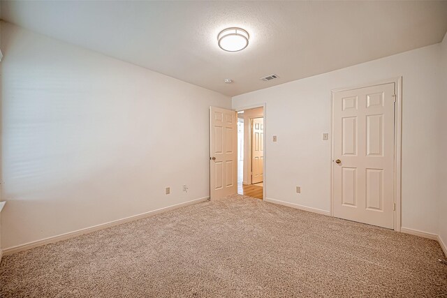 2810 Pineleaf Dr, Sugar Land, TX 77479 - unfurnished bedroom featuring light carpet and baseboards