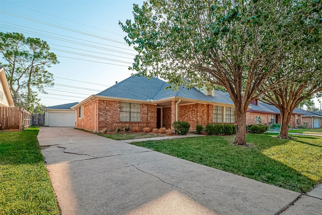 ranch-style house featuring a garage and a front lawn