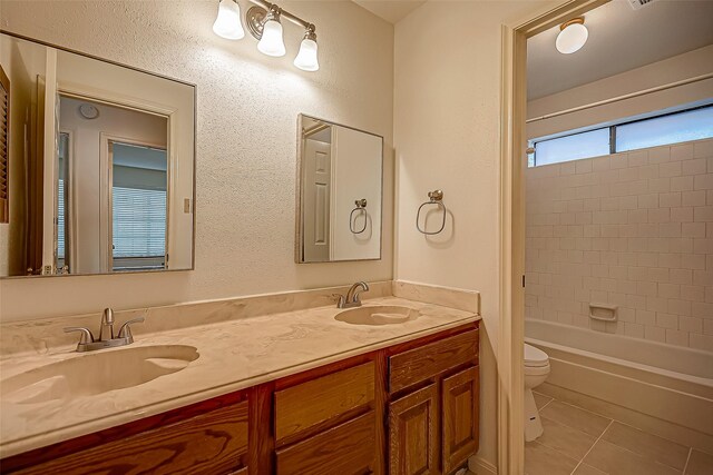 2810 Pineleaf Dr, Sugar Land, TX 77479 - full bath with toilet, tile patterned flooring, double vanity, and shower / bath combination
