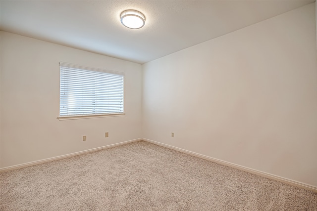 empty room featuring carpet flooring