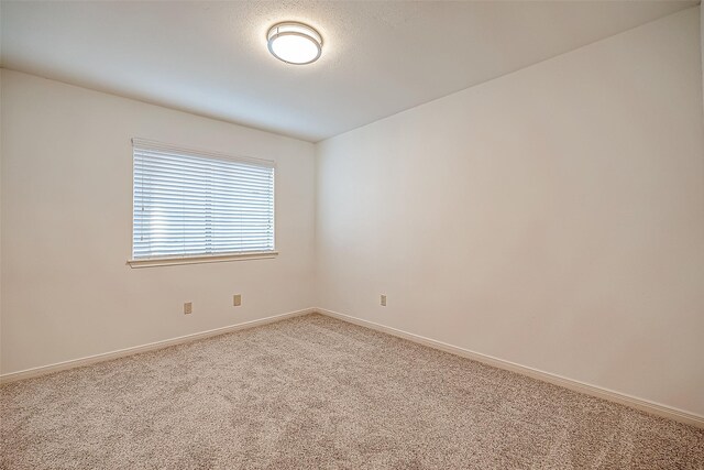2810 Pineleaf Dr, Sugar Land, TX 77479 - carpeted empty room featuring baseboards