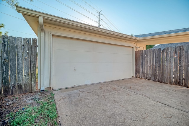 2810 Pineleaf Dr, Sugar Land, TX 77479 - garage featuring asphalt driveway and fence