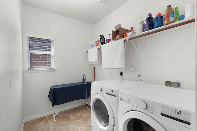 laundry area with washing machine and clothes dryer