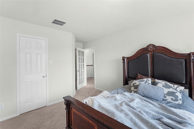 carpeted bedroom featuring french doors