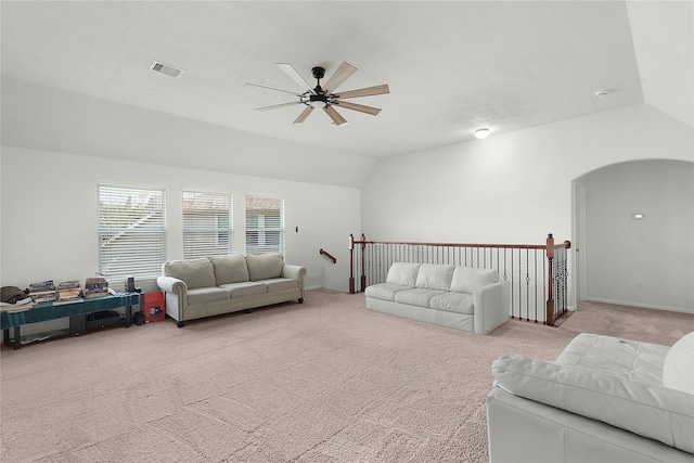 living room featuring ceiling fan, light colored carpet, and lofted ceiling