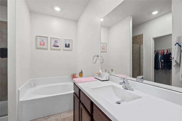 bathroom featuring tile patterned floors, separate shower and tub, and vanity