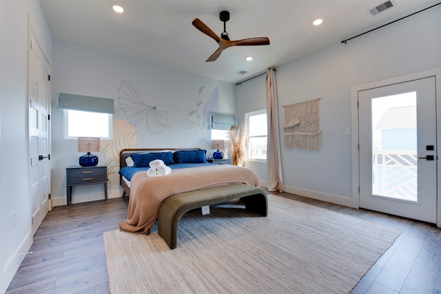 bedroom with ceiling fan, light wood-type flooring, and access to exterior