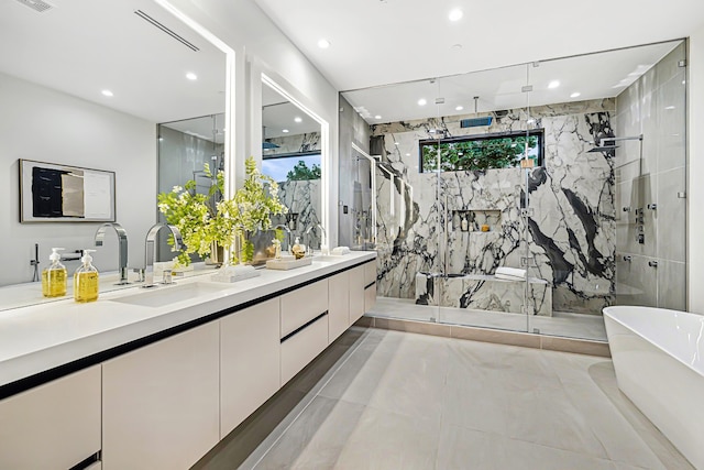 bathroom with plus walk in shower, tile patterned floors, vanity, and tile walls