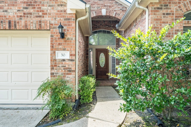 entrance to property featuring a garage