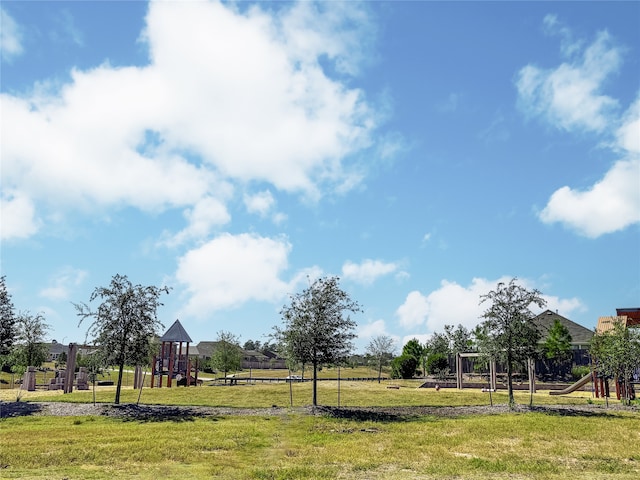 exterior space featuring a lawn and a playground