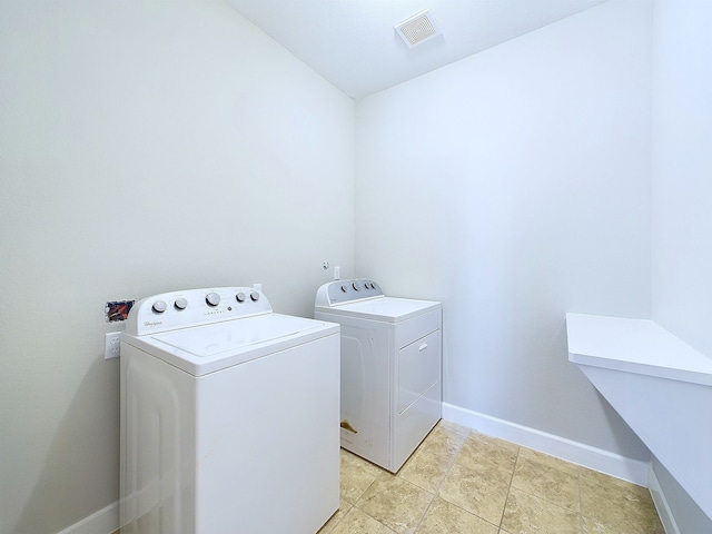 laundry room featuring washer and clothes dryer