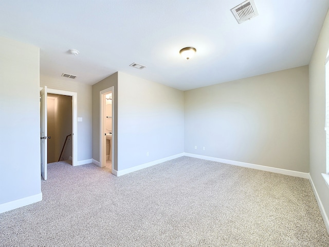 empty room with carpet flooring