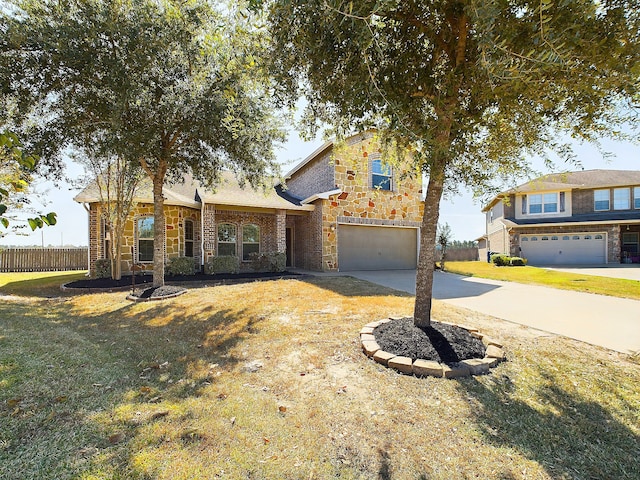 view of front of house with a front yard and a garage