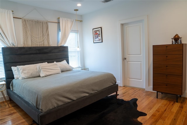 bedroom with light wood-type flooring