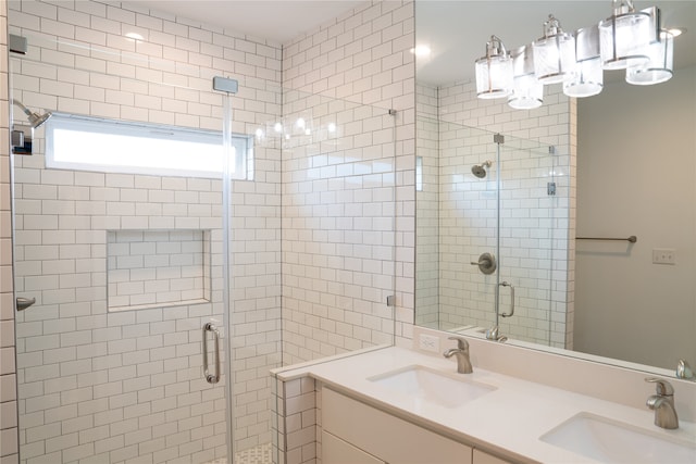 bathroom with walk in shower and vanity