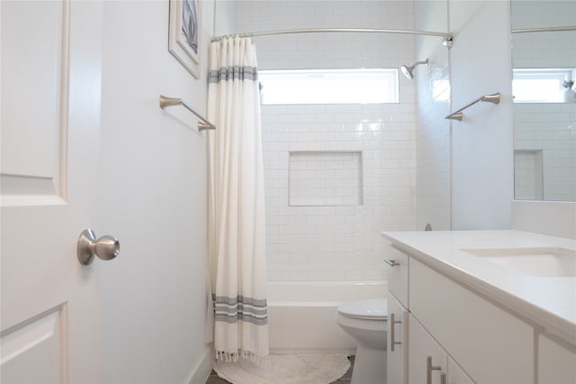 full bathroom with toilet, vanity, and shower / bathtub combination with curtain