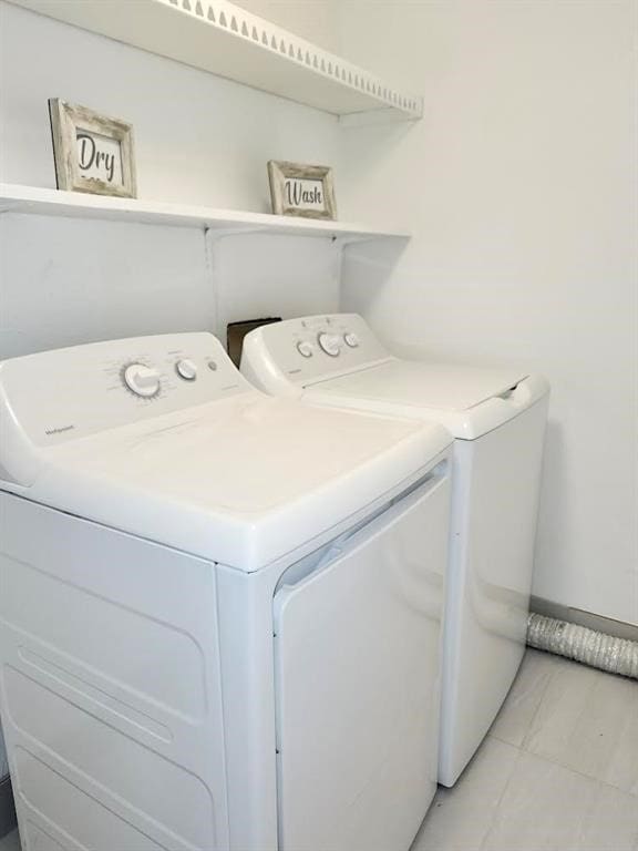 laundry room with washer and clothes dryer