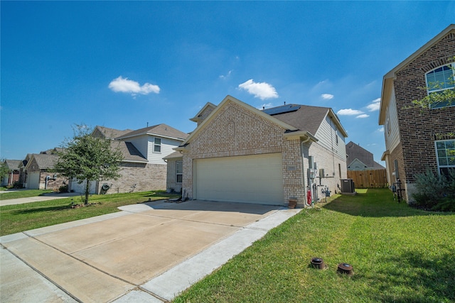 front of property with a front yard and a garage