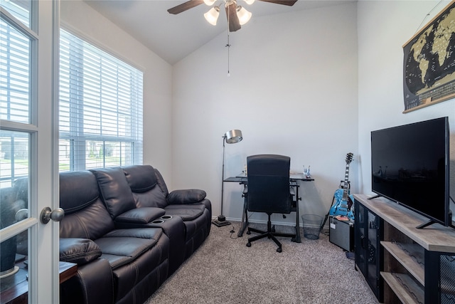 carpeted office with ceiling fan, high vaulted ceiling, and a wealth of natural light