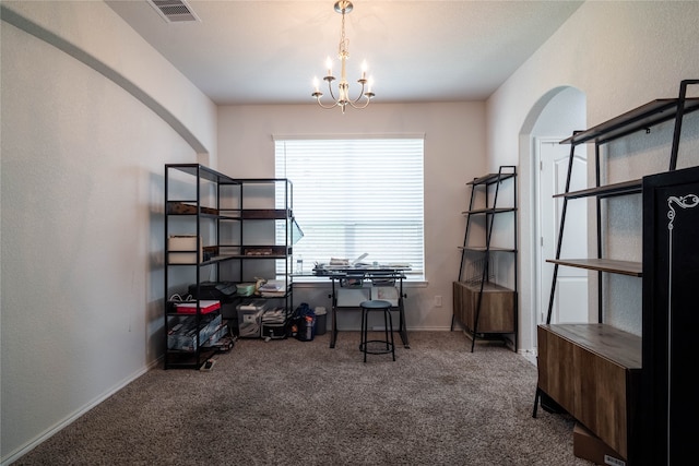 office space featuring carpet floors and a chandelier