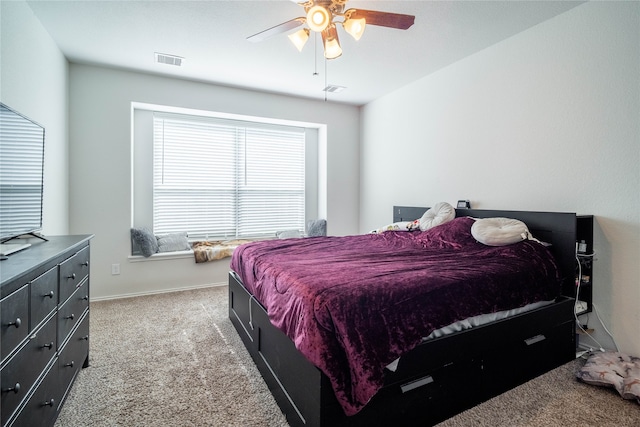 bedroom with ceiling fan and light colored carpet