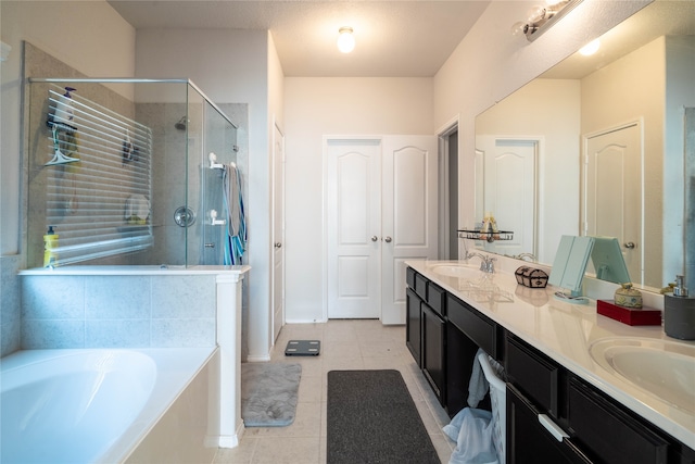 bathroom with vanity, shower with separate bathtub, and tile patterned flooring