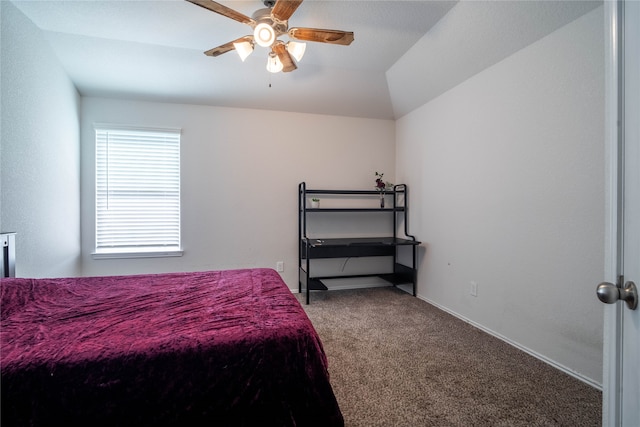 carpeted bedroom with ceiling fan and lofted ceiling