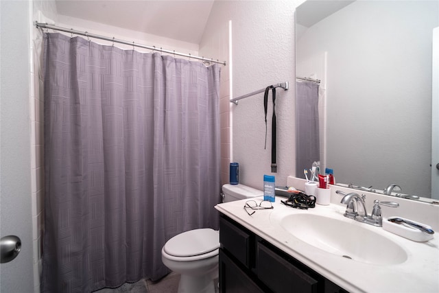 bathroom with vanity, toilet, and a shower with shower curtain