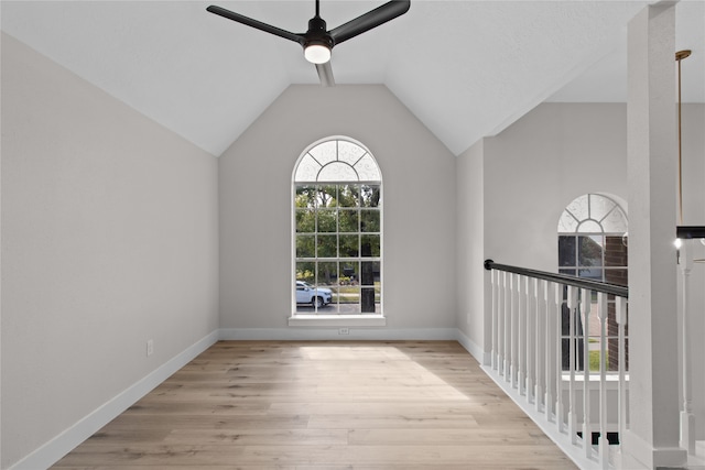 interior space with light hardwood / wood-style floors, ceiling fan, and lofted ceiling