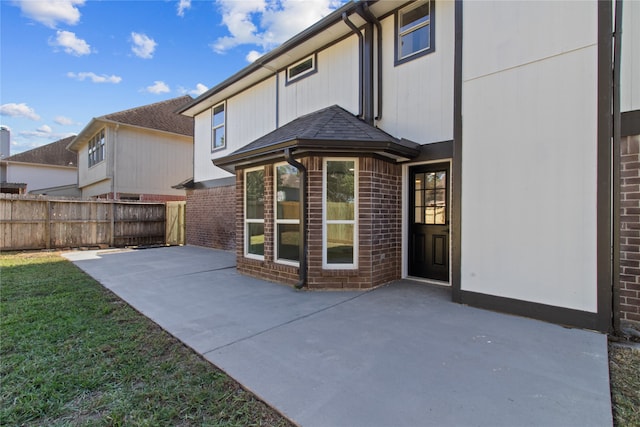 back of property featuring a patio