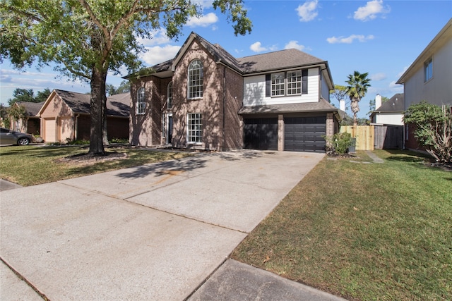 front facade with a garage and a front lawn