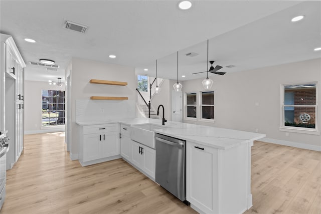 kitchen with kitchen peninsula, stainless steel appliances, ceiling fan, white cabinets, and hanging light fixtures