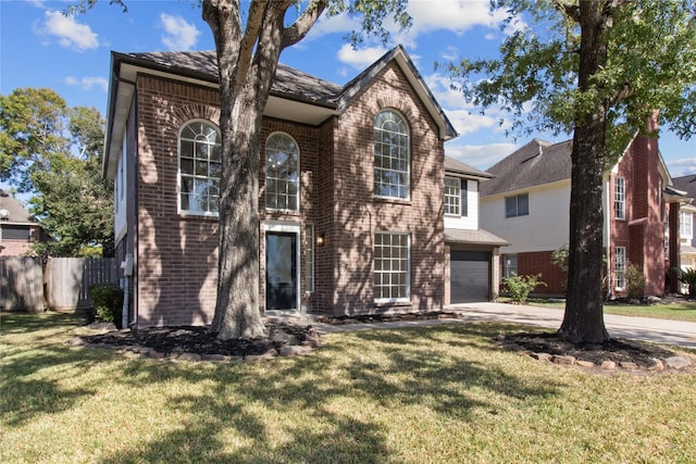 view of front facade featuring a garage and a front lawn