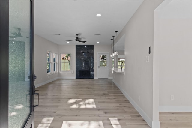 hallway with light hardwood / wood-style flooring