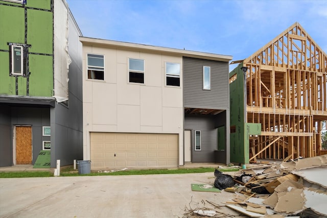 view of front of house with a garage and a deck