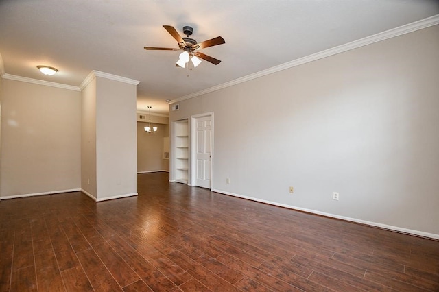 empty room featuring ceiling fan with notable chandelier, ornamental molding, and dark hardwood / wood-style floors