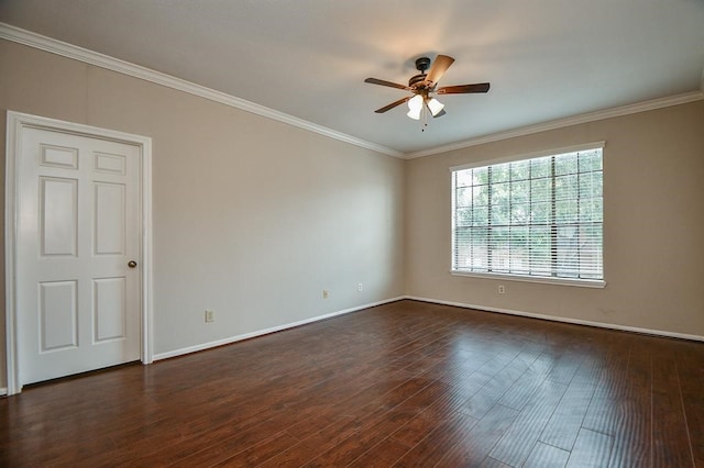 empty room with ornamental molding, ceiling fan, and dark hardwood / wood-style flooring