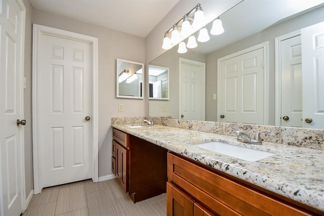 bathroom with vanity and tile patterned floors