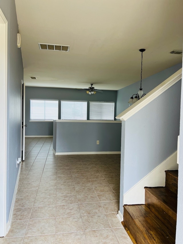 corridor featuring light tile patterned floors