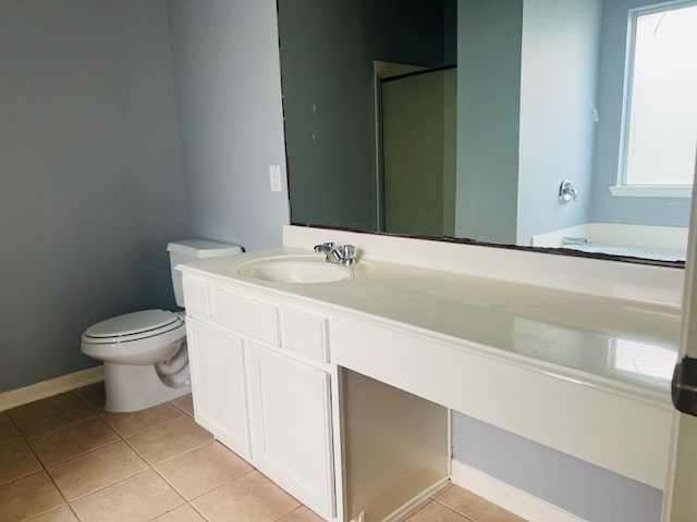 bathroom featuring vanity, tile patterned flooring, toilet, and a shower with door