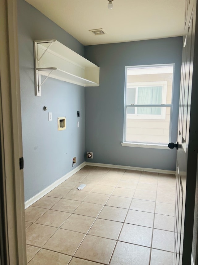 laundry area with light tile patterned flooring, hookup for a washing machine, and electric dryer hookup