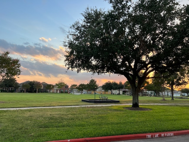 surrounding community featuring a lawn