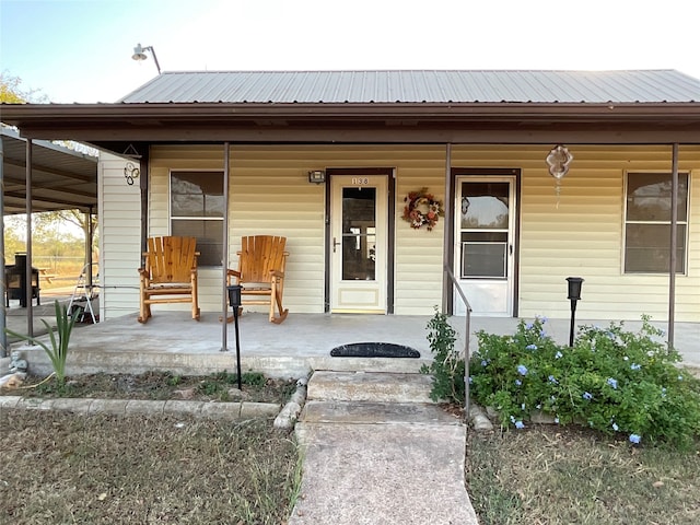 doorway to property with a porch