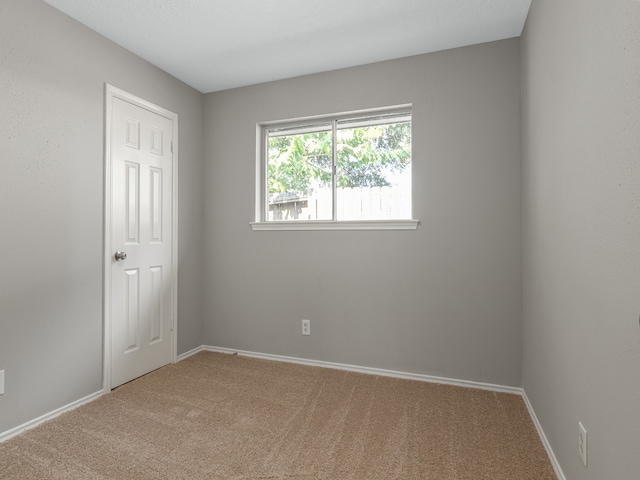 unfurnished room featuring carpet floors