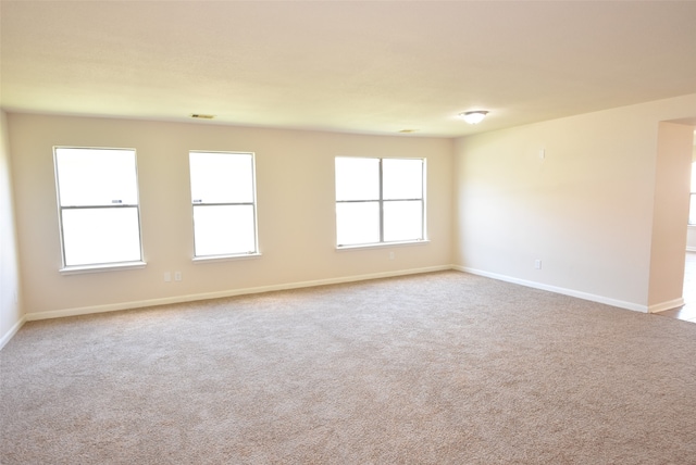 spare room with light colored carpet