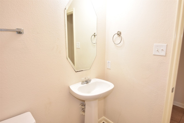 bathroom featuring toilet